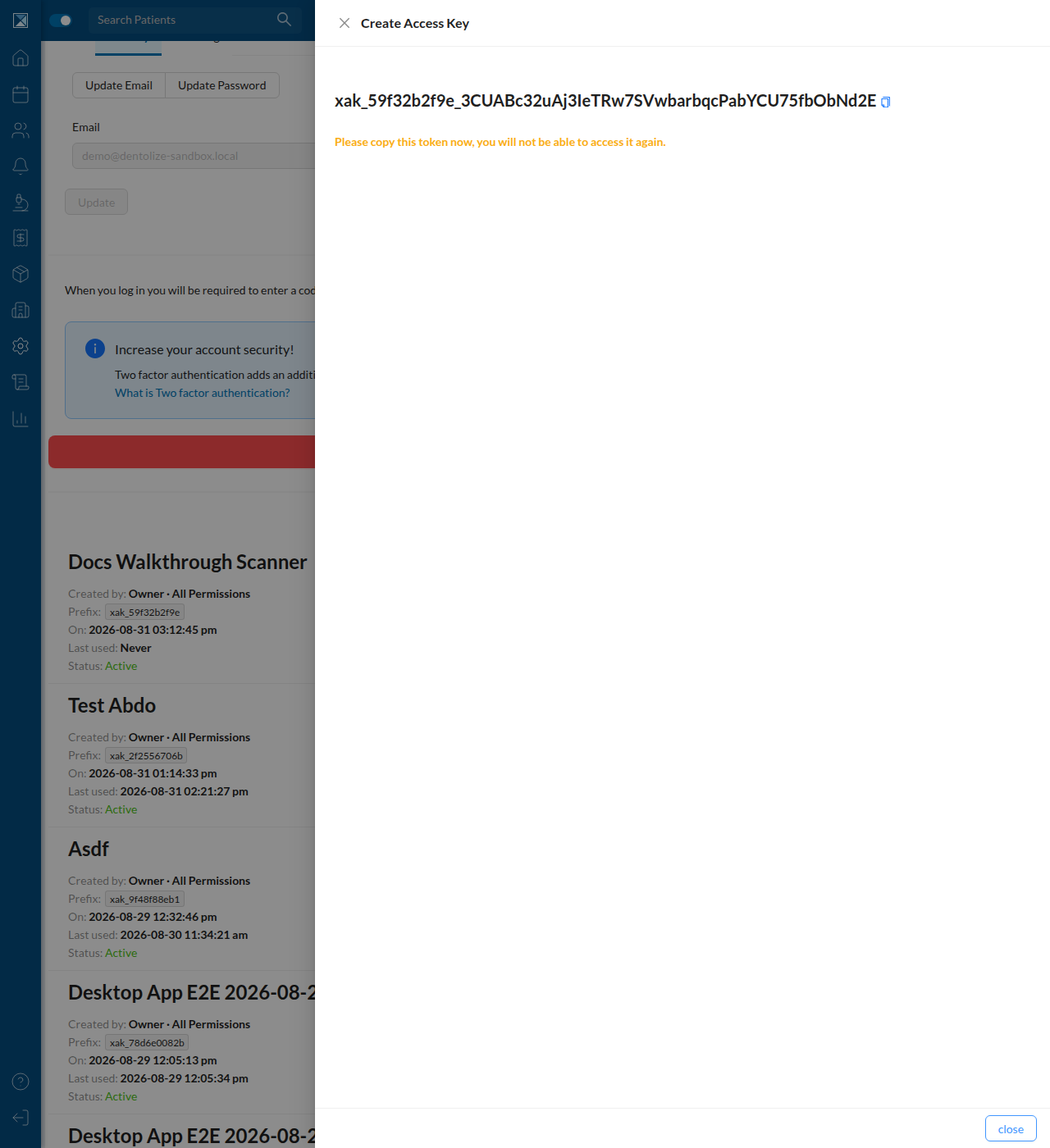 The newly generated key xak_59f32b2f9e_... shown once with a copy button and a warning